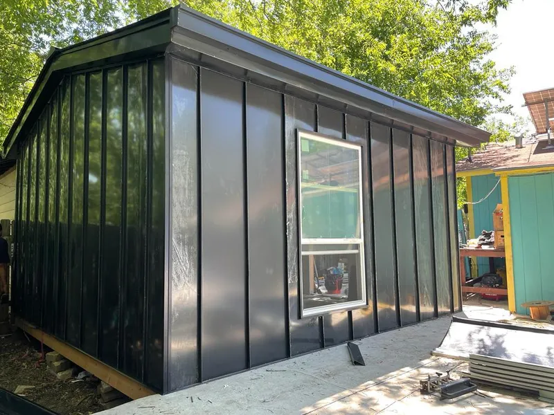 Black standing seam metal wall panels for Metal Roof Installation in Utica